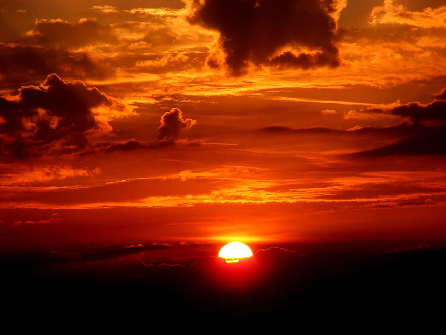 Dramatic Orange Sunset with Dark Clouds