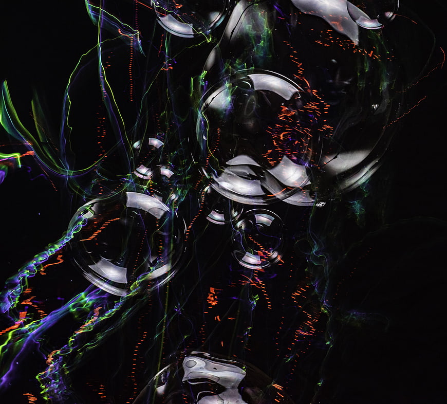 Abstract dark bubbles with neon light reflections