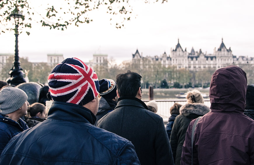 Man wearing Union Jack beanie in London crowd