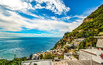 Aerial View of Colorful Coastal Village on Cliffside