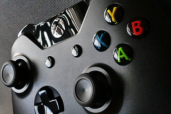 Close-up of Black Xbox Controller with Colorful Buttons