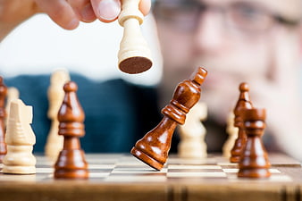 Hand Capturing Chess King Piece Strategy