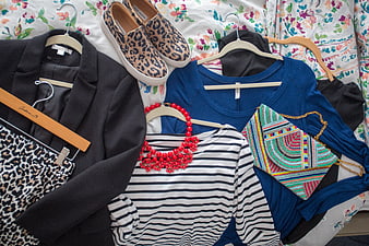 Flat lay of women's fashion outfit with leopard print shoes and accessories