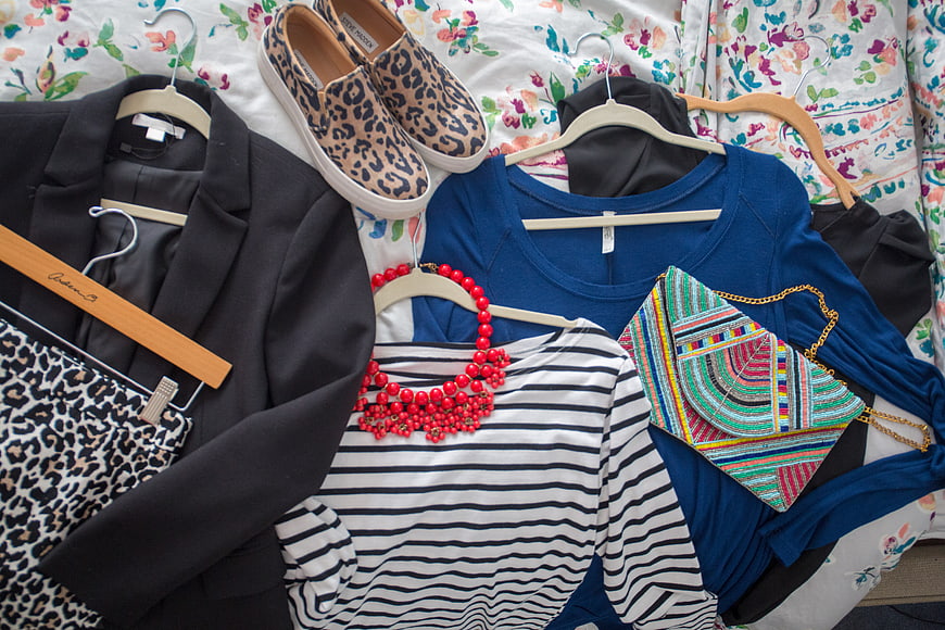 Flat lay of women's fashion outfit with leopard print shoes and accessories