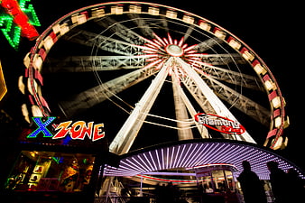 Illuminated Ferris Wheel at Night Amusement Park