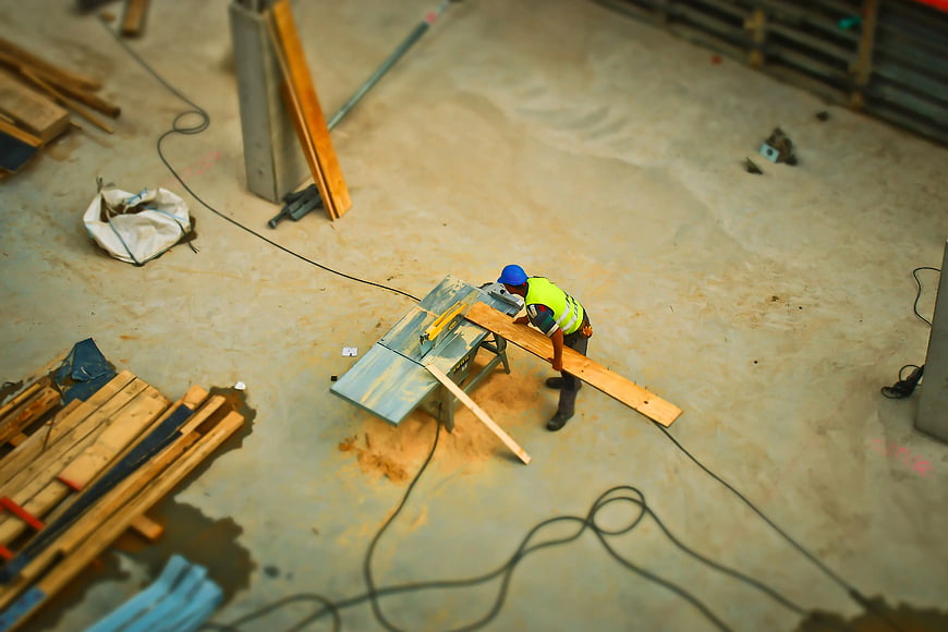 High Angle View of Construction Worker Using Table Saw