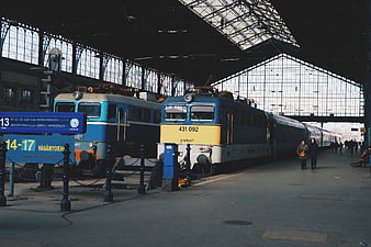 Vintage Blue and Yellow Locomotives at Train Station Platform