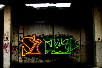 Colorful Graffiti Art on Weathered Concrete Wall