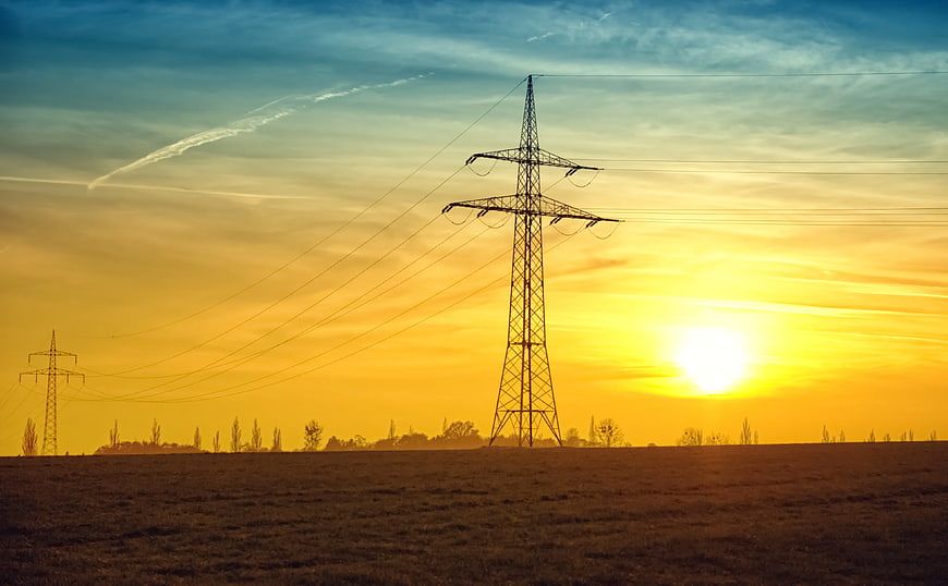 Silhouette of High Voltage Power Lines at Sunset