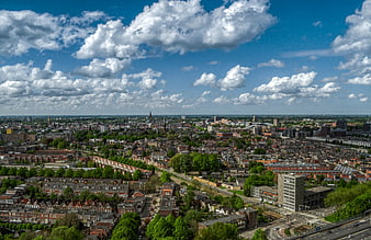 Aerial View of Urban Cityscape with Blue Sky and Clouds