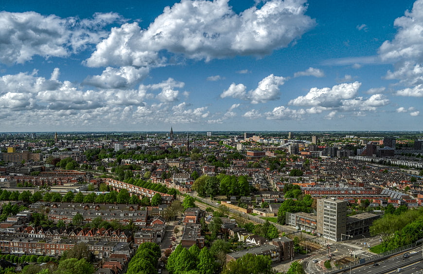 Aerial View of Urban Cityscape with Blue Sky and Clouds