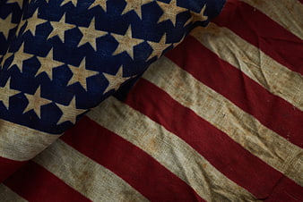 Close-up of vintage weathered American flag fabric texture
