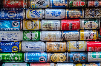 Stack of weathered vintage beer and soda cans