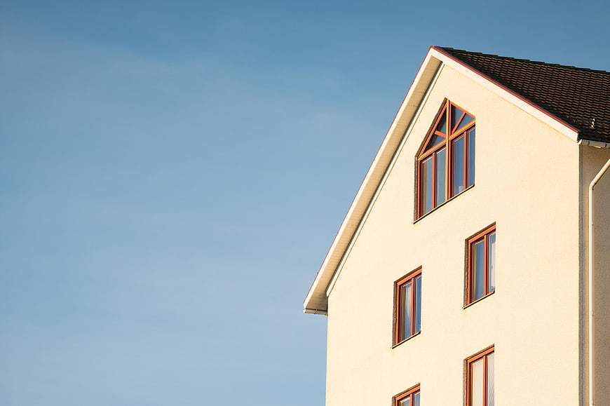 Modern Beige House Corner Against Blue Sky