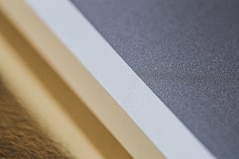 Abstract diagonal stripes with beige, white, and gray textured surfaces