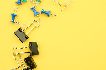 Office Supplies on Yellow Background with Copy Space