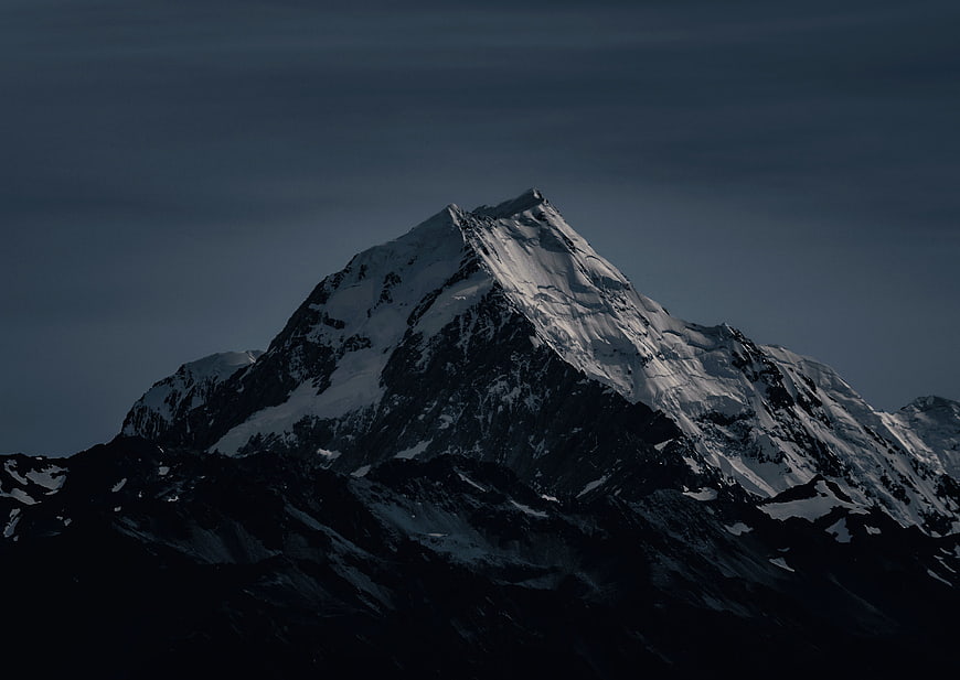 Dramatic Snow-Capped Mountain Peak at Dusk