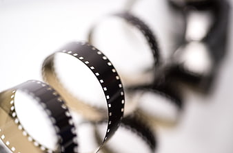 Close-up of vintage 8mm film strip on white background
