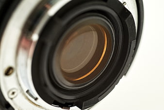 Close-up of camera lens aperture on white background