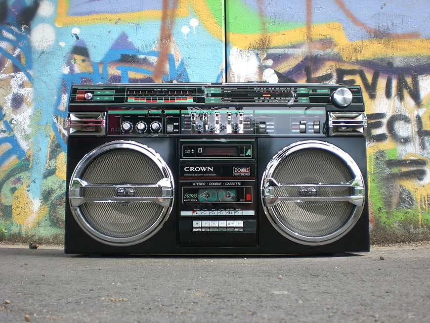 Vintage Crown Boombox Against Colorful Graffiti Wall
