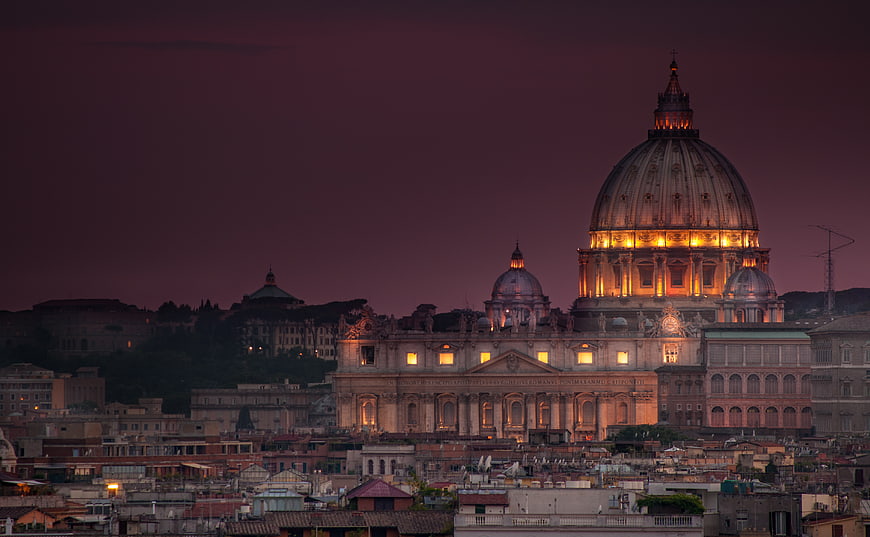 Illuminated St. Peter's Basilica Dome at Dusk in Rome