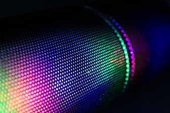 Close-up of colorful LED speaker grille with rainbow lights