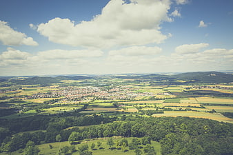 Aerial View of European Town Surrounded by Green Fields and Forest