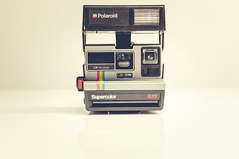 Vintage Polaroid Supercolor 635 Instant Camera on White Background