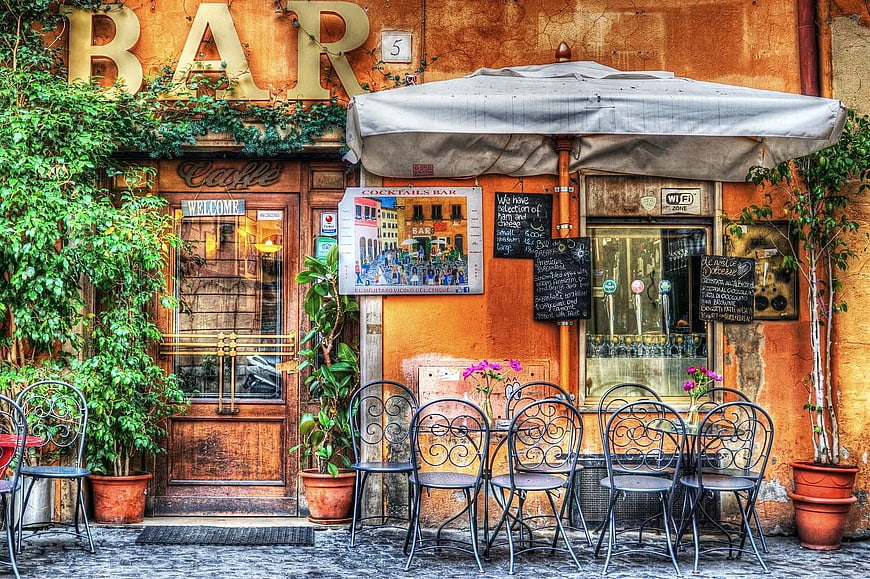Charming European Bar Facade with Outdoor Seating