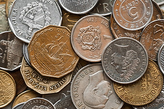 Close-up of mixed international coins and currency