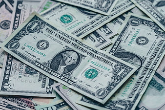 Scattered US Dollar Bills Close-Up Background