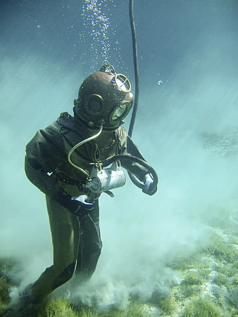 Vintage Scuba Diver in Deep Ocean Water