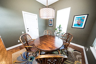 Modern dining room with wooden table and gray walls
