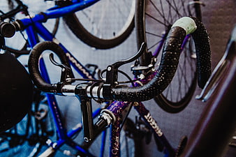 Close-up of wet bicycle handlebars in a bike shop