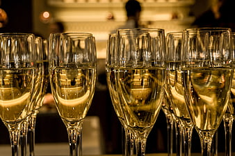 Close-up of champagne glasses with golden bubbly liquid