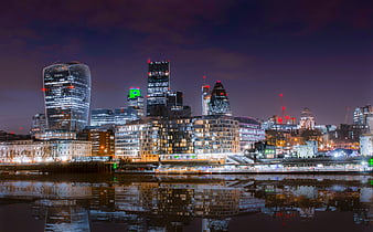 London City Skyline at Night with Reflections