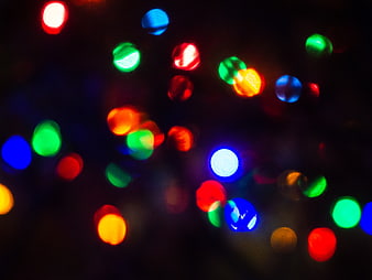Abstract colorful bokeh lights on dark background