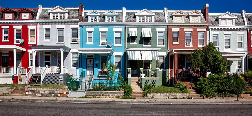 Colorful row houses on a sunny city street
