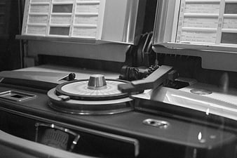 Close-up of vintage jukebox turntable and record selection