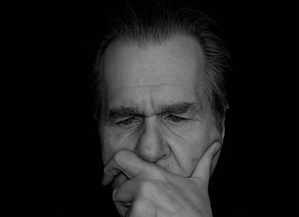 Black and white portrait of a thoughtful senior man