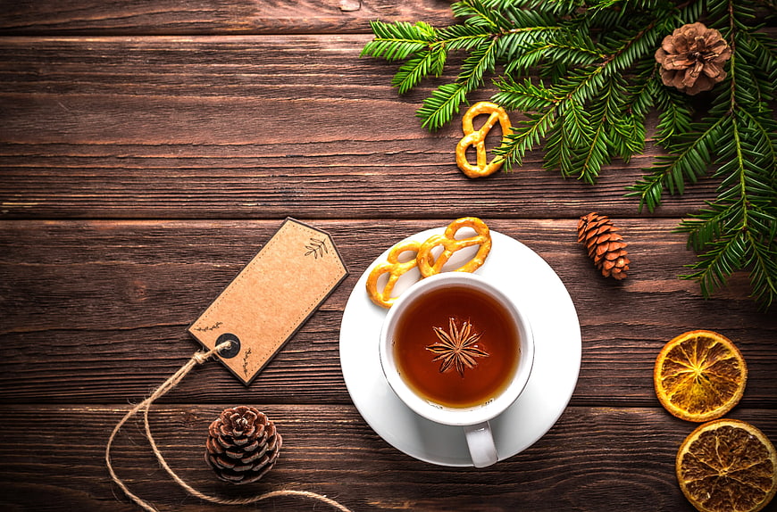 Top View of Spiced Tea with Pretzels and Christmas Decorations
