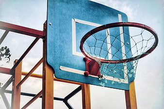 Outdoor Basketball Hoop and Backboard Against Sky