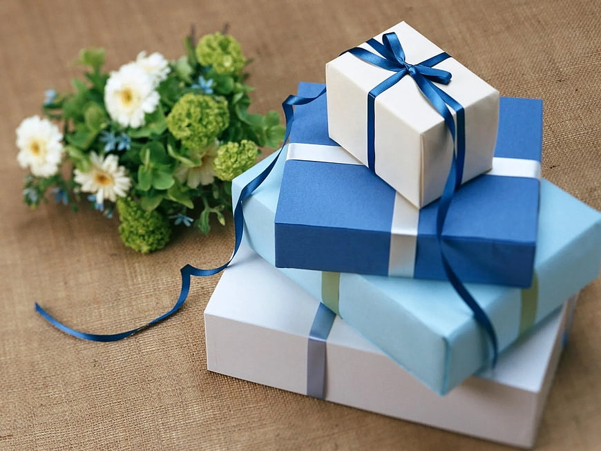 Stacked Blue and White Gift Boxes with Flowers