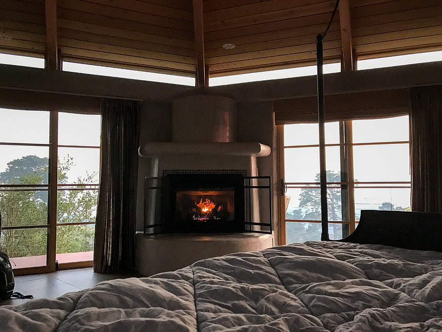 Cozy Bedroom with Fireplace and Large Windows