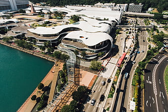 Aerial view of modern waterfront architecture and busy highway