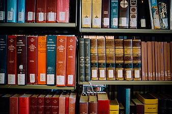 Colorful vintage books on library shelves