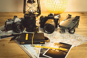 Photography equipment and travel map on wooden table