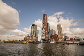 Rotterdam skyline skyscrapers harbor water clouds