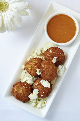 Crispy fried appetizers with blue cheese and dipping sauce