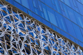 Modern Blue Glass Building with Geometric White Facade